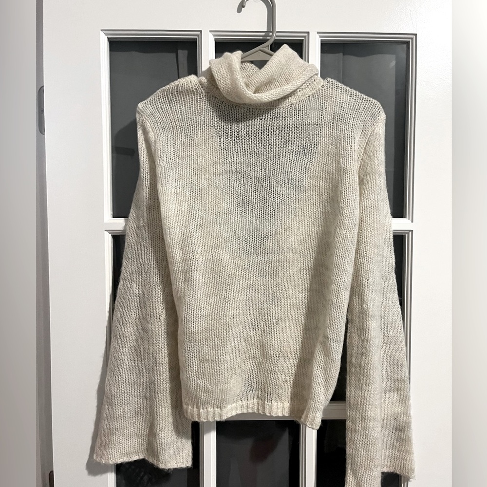 New-Open back turtleneck sweater